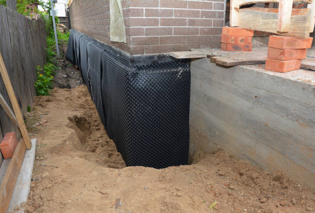 Happy homeowners after waterproofing job in Erwin